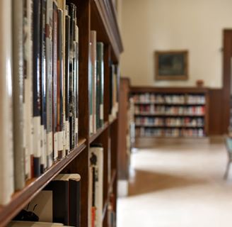 A full bookshelf in a college library.
