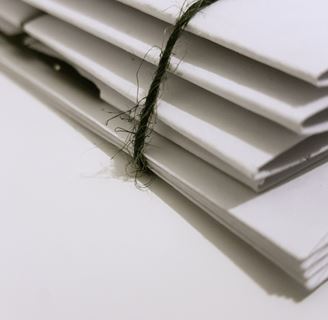 A stack of bound documents.